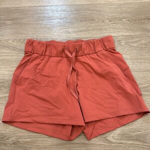 Coral-colored Lululemon shorts Size 4